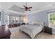 Spacious main bedroom with trey ceiling, natural light, and serene ambiance featuring neutral walls and wood floors at 3500 Maplewood Ln, Mount Pleasant, SC 29466