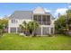 Expansive backyard with lawn and the home's screened in porch at 3526 Stockton Dr, Mount Pleasant, SC 29466