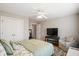 Comfortable bedroom featuring a bed, sitting chair, TV, and a neutral color scheme for a relaxing atmosphere at 3526 Stockton Dr, Mount Pleasant, SC 29466