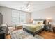 Bright, spacious bedroom with hardwood floors, a large window, and a cozy sitting area next to a bed at 3526 Stockton Dr, Mount Pleasant, SC 29466