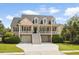 Charming two-story home features a double front porch, manicured lawn, and driveway at 3526 Stockton Dr, Mount Pleasant, SC 29466