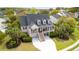 Beautiful home exterior showing double porches, dormer windows, mature landscaping, and a spacious driveway at 3526 Stockton Dr, Mount Pleasant, SC 29466