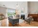 Bright living room features a fireplace, piano, and large window at 3526 Stockton Dr, Mount Pleasant, SC 29466