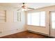 Bright living room featuring hardwood floors, built-in shelving, and plenty of natural light from a large window at 356 Price St, Goose Creek, SC 29445