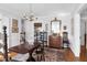 Traditional dining room featuring hardwood floors, antique furniture, and natural light at 41 Berkeley Rd, Charleston, SC 29407