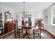 Spacious dining room featuring hardwood floors and an ornate vintage chandelier and furnishings at 41 Berkeley Rd, Charleston, SC 29407