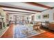 Cozy living room featuring a fireplace, hardwood floors, and comfortable seating area at 41 Berkeley Rd, Charleston, SC 29407