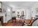 Bright living room with hardwood floors, fireplace, and multiple doorways for easy access at 41 Berkeley Rd, Charleston, SC 29407