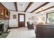 Inviting living room features a brick fireplace, beamed ceilings, and cozy seating at 41 Berkeley Rd, Charleston, SC 29407