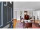 Cozy living room with hardwood floors, vintage furnishings and charming decor at 41 Berkeley Rd, Charleston, SC 29407
