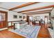 Open living room with hardwood floors, exposed beam ceiling, and lots of natural light at 41 Berkeley Rd, Charleston, SC 29407