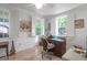 Home office featuring bright natural light, stone tiled floors and a ceiling fan at 41 Berkeley Rd, Charleston, SC 29407