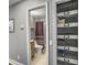 Bathroom with tiled floors, modern toilet, sink with wood cabinet and shower with a curtain at 416 Jelly Rolls Rd, Moncks Corner, SC 29461