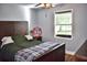 Comfortable bedroom with a ceiling fan, ample natural light, and a charming decor piece on the wall at 416 Jelly Rolls Rd, Moncks Corner, SC 29461