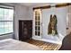 Charming bedroom featuring a sliding barn door, hardwood floors, and a bright window for lots of natural light at 416 Jelly Rolls Rd, Moncks Corner, SC 29461