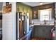 Well-lit kitchen boasts stainless steel appliances, granite countertops, and modern finishes at 416 Jelly Rolls Rd, Moncks Corner, SC 29461