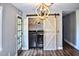 Functional laundry room equipped with modern washer and dryer and stylish barn door at 416 Jelly Rolls Rd, Moncks Corner, SC 29461