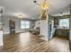 Open concept living room and kitchen with pendant lighting, stainless appliances, and beautiful floors at 416 Jelly Rolls Rd, Moncks Corner, SC 29461