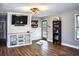 Cozy living room features stylish wood flooring, built-in media center, and bright natural light at 416 Jelly Rolls Rd, Moncks Corner, SC 29461