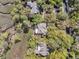 An aerial view of lush trees and homes, near a marsh at 418 Snowy Egret Ln, Kiawah Island, SC 29455