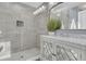 This bathroom features a glass shower with a marble sink and an ornate mirror at 418 Snowy Egret Ln, Kiawah Island, SC 29455