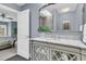 Bathroom featuring a single sink vanity with a large mirror and decorative wall art at 418 Snowy Egret Ln, Kiawah Island, SC 29455