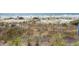 Beachfront view with sand dunes, wooden fence and ocean views perfect for outdoor recreation at 418 Snowy Egret Ln, Kiawah Island, SC 29455