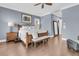 Spacious bedroom with hardwood floors, a decorative bench, and neutral paint at 418 Snowy Egret Ln, Kiawah Island, SC 29455