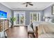 Bright bedroom with hardwood floors, ceiling fan, and access to a private outdoor patio at 418 Snowy Egret Ln, Kiawah Island, SC 29455