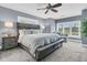 Comfortable bedroom with a ceiling fan and large windows offering natural light at 418 Snowy Egret Ln, Kiawah Island, SC 29455