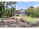 Beautiful home surrounded by lush trees and vegetation, offering both privacy and a serene setting at 418 Snowy Egret Ln, Kiawah Island, SC 29455