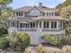 Charming home featuring a spacious deck, ample windows, and lush landscaping at 418 Snowy Egret Ln, Kiawah Island, SC 29455