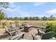Inviting fire pit surrounded by Adirondack chairs with scenic views creating a relaxing outdoor experience at 418 Snowy Egret Ln, Kiawah Island, SC 29455