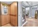 Entryway with wood elevator, hardwood floors, staircase, and view into the dining room at 418 Snowy Egret Ln, Kiawah Island, SC 29455