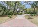 Charming home featuring a brick driveway and lush landscaping at 418 Snowy Egret Ln, Kiawah Island, SC 29455