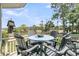Picturesque outdoor patio featuring dining table and chairs with tranquil views at 418 Snowy Egret Ln, Kiawah Island, SC 29455