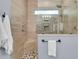 Modern shower featuring tile surround, mosaic tile accents, and glass enclosure at 418 Snowy Egret Ln, Kiawah Island, SC 29455
