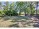 Large, partially shaded backyard with mature trees at 4412 Garwood Dr, Ladson, SC 29456