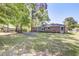 Brick home backyard with mature trees and ample green space at 4412 Garwood Dr, Ladson, SC 29456