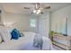 Bedroom with bright walls, wood-look flooring, ceiling fan and a nice window at 4412 Garwood Dr, Ladson, SC 29456