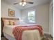Bedroom features a light colored walls, wood-look floors, ceiling fan and a big window at 4412 Garwood Dr, Ladson, SC 29456