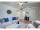 Living room with stylish furniture, vaulted ceilings, blue accents, and a decorative area rug at 4412 Garwood Dr, Ladson, SC 29456