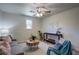 Living room featuring neutral walls, wood-look flooring, ceiling fan, couch and accent chairs at 4412 Garwood Dr, Ladson, SC 29456