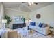 Bright and airy living room features vaulted ceilings, stylish furniture, and a neutral color palette at 4412 Garwood Dr, Ladson, SC 29456