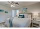 Bright and airy bedroom features wood-look floors, ceiling fan, and modern decor at 4412 Garwood Dr, Ladson, SC 29456