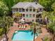 Expansive backyard with a sparkling pool, lounge chairs, and multi-level decks perfect for entertaining at 4952 Steeplechase Ln, Hollywood, SC 29449