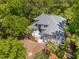 Beautiful home on a sunny day, showcasing lush landscaping and a brick driveway at 4952 Steeplechase Ln, Hollywood, SC 29449