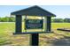 A sign showing the dedication of Jack T. Day Amenity Field to the community at 4952 Steeplechase Ln, Hollywood, SC 29449