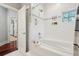 Bright white bathroom with a soaking tub, tiled shower, and modern fixtures at 4952 Steeplechase Ln, Hollywood, SC 29449