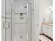 Modern bathroom with glass shower doors and a vanity with granite countertops at 4952 Steeplechase Ln, Hollywood, SC 29449